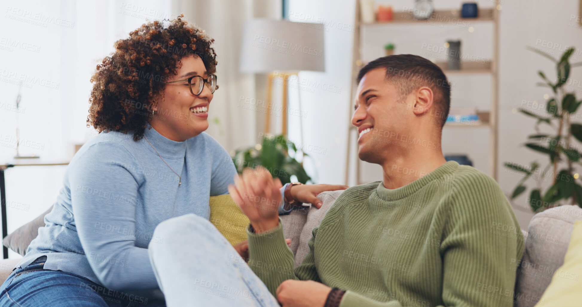 Buy stock photo Love, conversation and couple on sofa together and talking as communication for bonding in living room. Laughing, man and woman on couch speaking of funny joke in apartment lounge in relationship