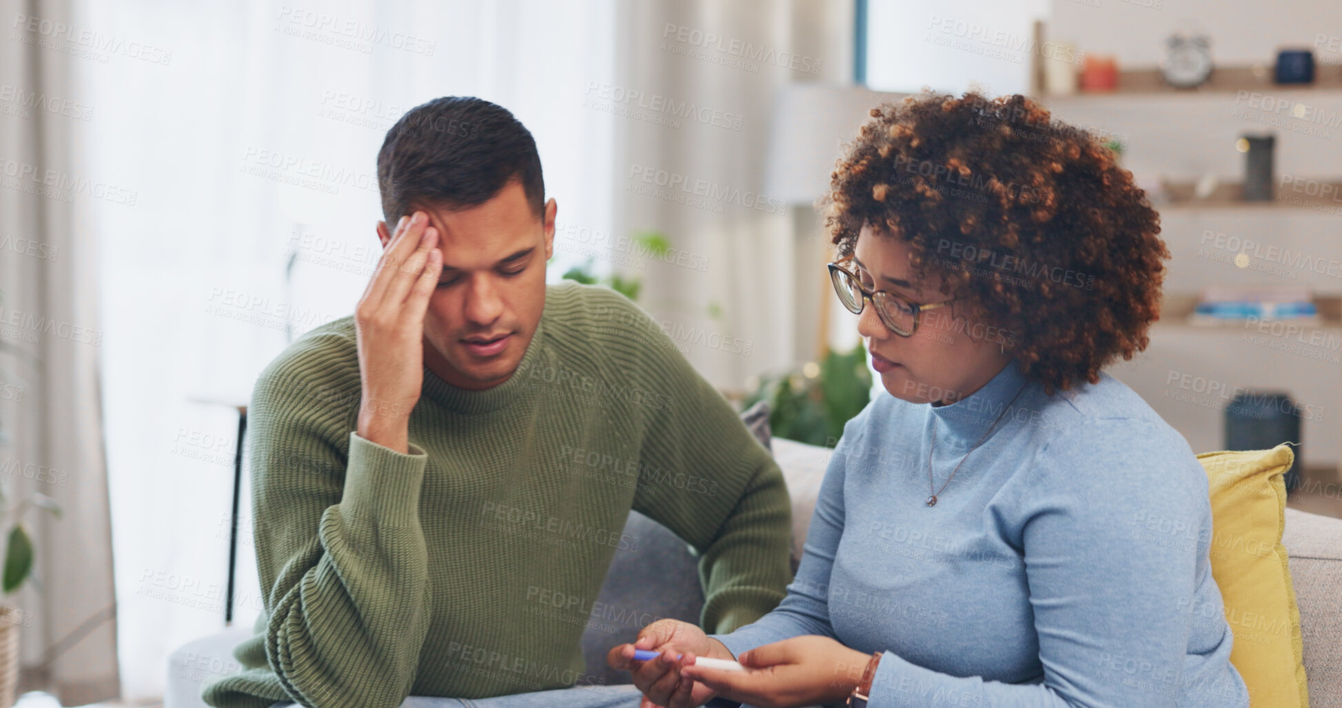 Buy stock photo Couple, pregnancy test and sad with fail on sofa, stress and disappointed in home living room. Sad couple, infertility and results with depression, mental health and news on lounge couch in house