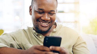 Buy stock photo Black man, phone and relax on sofa for social media, communication or networking in living room at home. Happiness, African person and smile on couch with mobile smartphone for browsing or chatting