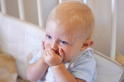 Buy stock photo Happy, face and toddler standing in crib, bedroom or excited baby boy with hands on teething mouth for morning surprise of mistake. Kid sitting in cot, awake and healthy bed routine for young child