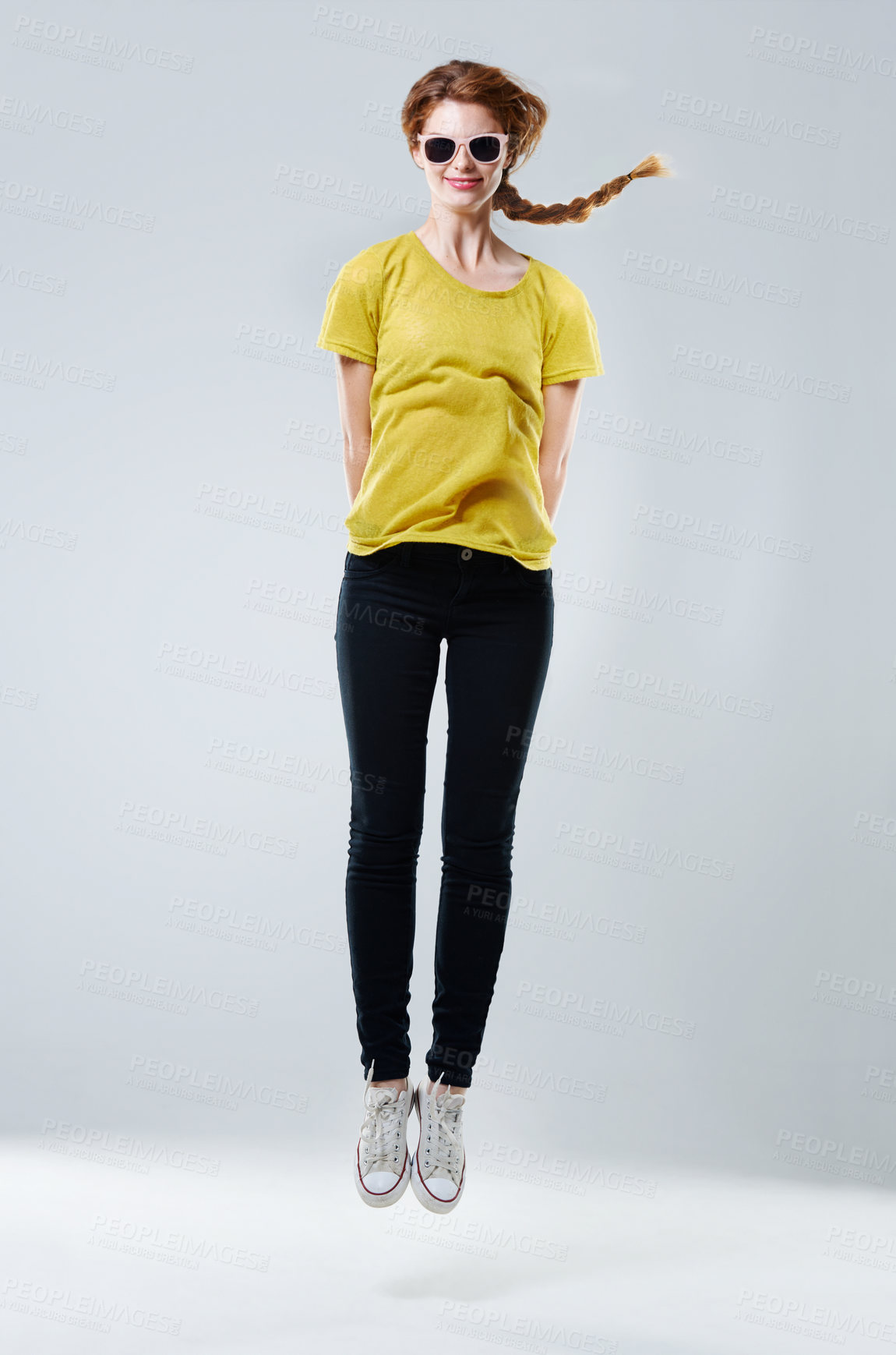 Buy stock photo Girl, sunglasses and casual jump in studio, designer fashion and energy on white background. Female person, clothes and teenager aesthetic for celebration of adolescent youth, luxury shades and style