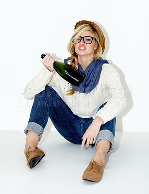 Buy stock photo Champagne, drunk or woman on floor with hangover from hipster, rebel or event in studio. Relax, festive or female person drinking alcohol or beverage in bottle for New Year on white background
