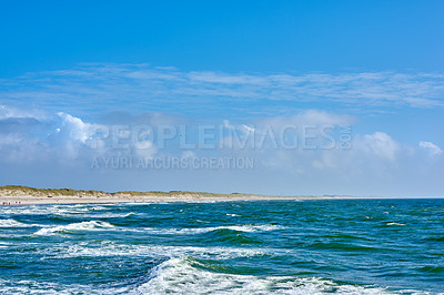 Buy stock photo Ocean, water and waves in nature for travel, holiday or summer vacation destination on island. Sea coast, beach or environment with blue sky, land and clouds on horizon at tourism location in Denmark