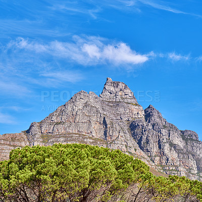Buy stock photo Copy space with scenic landscape view of Table Mountain in Cape Town, South Africa against a cloudy blue sky background. Beautiful panoramic of an iconic landmark and famous travel destination