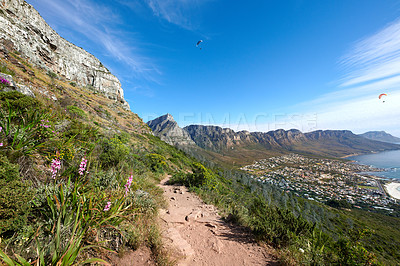 Buy stock photo Scenic hiking trail on a mountain. The twelve apostles in Cape Town, South Africa with plants against a blue sky. Relaxing view of a beautiful and rugged natural landscape to explore and travel