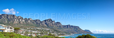 Buy stock photo Twelve Apostles at Table Mountain in Cape Town against a blue sky background along the coast. Breathtaking panoramic of a peaceful suburb surrounded by a majestic valley, scenic nature and calm sea
