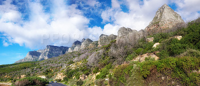 Buy stock photo Landscape of a mountain with trees and grass on a cloudy blue sky day. Forest on a mountainous hiking site with green plants on a natural landmark for outdoor nature exploring adventure in Cape Town