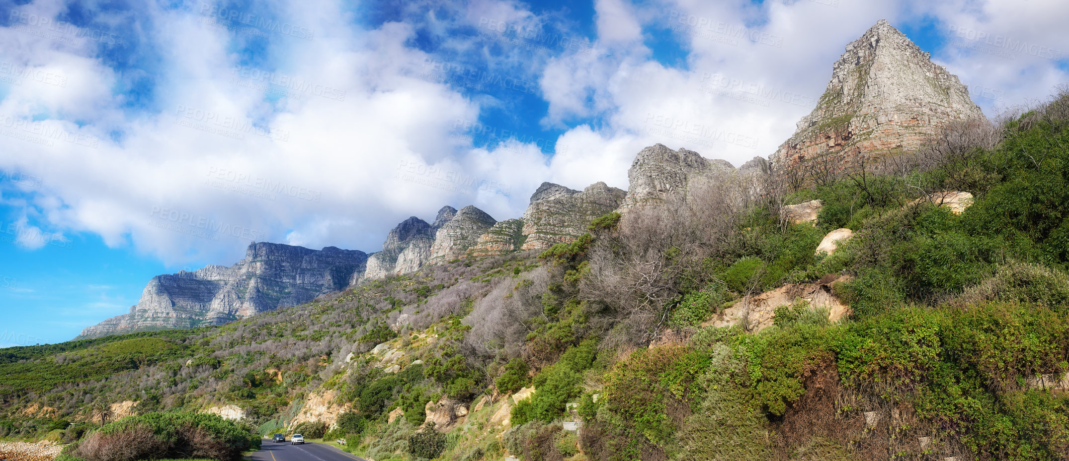 Buy stock photo Landscape of a mountain with trees and grass on a cloudy blue sky day. Forest on a mountainous hiking site with green plants on a natural landmark for outdoor nature exploring adventure in Cape Town