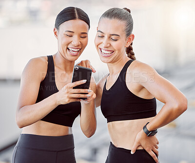 Buy stock photo Relax, sports women and friends on smartphone social media app for break at fitness training. Interracial girl friendship fun, leisure and internet entertainment for workout rest together.

