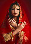 Fashion, culture and portrait of Indian woman with hand sign in traditional clothes, jewellery and sari veil. Religion, beauty and female person on red background with accessory, cosmetics and makeup