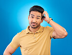 Portrait, head scratch and man confused over question, doubt or uncertain about problem crisis, error or decision. Studio, face and male person unsure about choice isolated on blue background