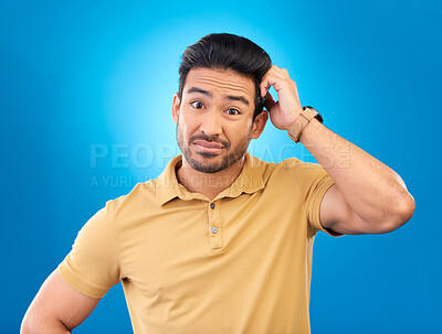 Buy stock photo Portrait, head scratch and man confused over question, doubt or uncertain about problem crisis, error or decision. Studio, face and Asian male person unsure about choice isolated on blue background