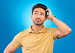 Thinking, head scratch and man brainstorming solution, problem solving plan or strategy development ideas. Studio, uncertain and confused person think of questions, why or doubt on blue background