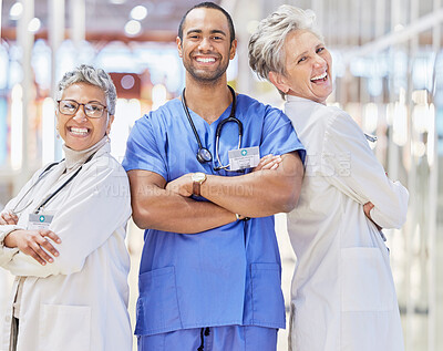 Buy stock photo Collaboration, doctor and healthcare with crossed arms in portrait at hospital, smile and laugh for leadership. Medical professional, teamwork and happy group at clinic for service, positive mindset.
