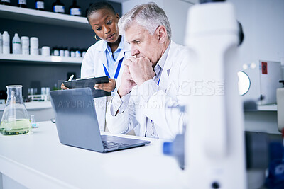 Buy stock photo Science, laptop and thinking in a laboratory for problem solving, medical research or results. Serious man and woman scientist or doctor with tech for scientific innovation, planning or teamwork