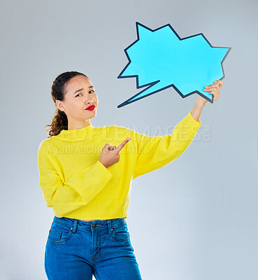 Buy stock photo Speech bubble, confused and woman pointing to chat, social media opinion and confused for translation in portrait. Gen z person with doubt, question and language mockup or quote on studio background