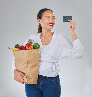 Buy stock photo Credit card, online and woman grocery shopping for fruits, vegetables and studio isolated on a white background. Sustainable bag, food and happy customer with digital money, ecommerce and fintech.