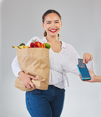 Buy stock photo Card machine, groceries and woman in portrait for POS, shop payment and fintech or digital finance. Grocery shopping, credit and cashier hands, people and food bag, point of sale on studio background