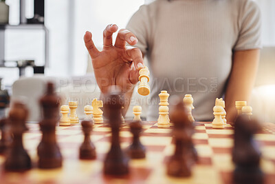 Buy stock photo Chess, game and woman with board moving piece for strategy, thinking and challenge in home. Competition, problem solving and hands of female person with chessboard in living room playing to checkmate
