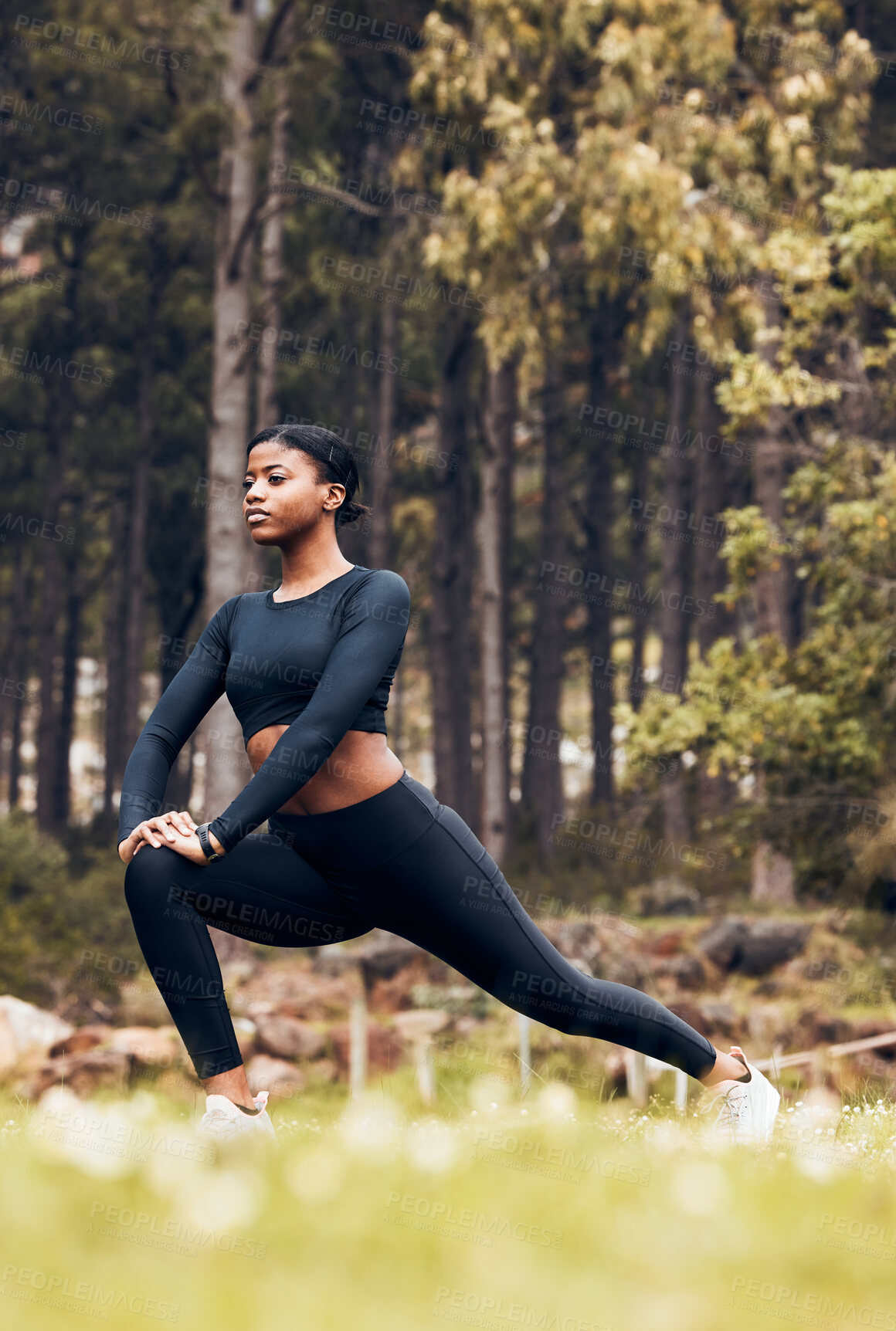 Buy stock photo Stretching, fitness and black woman lunge in nature for exercise, training and sports in forest. Hiking, mountain and female person stretch legs for warm up, workout and wellness for performance