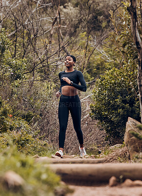 Buy stock photo Fitness, running and health with black woman in nature for workout, wellness and morning. Exercise, challenge and performance with female runner on forest trail for training, marathon and cardio