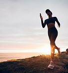 Running, sunrise and woman on mountain by ocean for exercise, marathon training and fitness. Sports, performance and female person in nature for warm up, cardio workout and body wellness in morning