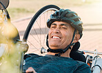 Happy man with disability, handcycle and bike for sports, race or cardio contest. Bicycle, male cyclist or face of athlete with paraplegia cycling in competition, challenge or smile of outdoor action