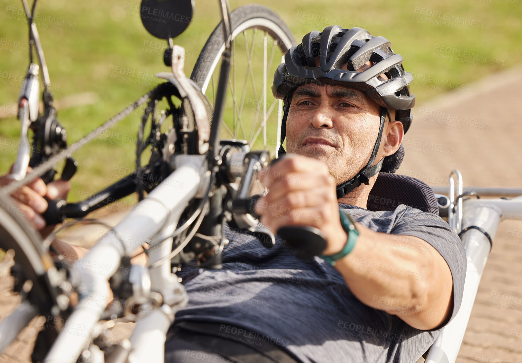 Buy stock photo Man with disability, handbike and cycling outdoor for sports, race and endurance contest. Bicycle, male rider and athlete with physical health condition on bike with focus, competition and challenge
