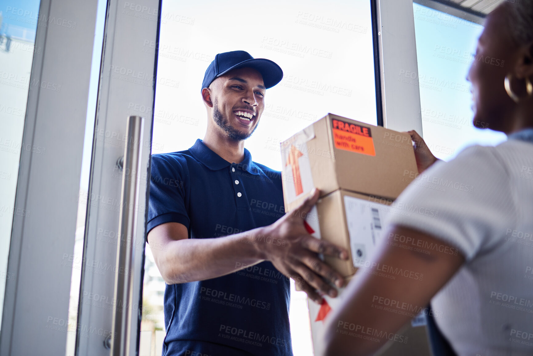 Buy stock photo Ecommerce, happy delivery man with box and woman at her front door. Online shopping or logistics, supply chain or distribution and African female person receive her cardboard parcel with smile