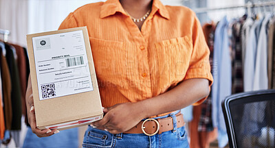 Buy stock photo Hands, designer or woman with box for delivery, shipping or package with logistics in ecommerce in office. Closeup, fashion or business owner with clothes stock or store order for courier service 