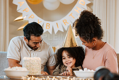 Buy stock photo Father, mother and child at birthday party, cake and happy with celebration, care and bonding in family home. Dad, mom and young kid with event, excited face and smile together at table in house