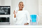 Portrait, glass and black woman drinking water, detox and health with nutrition, happiness and wellness. Face, female person or girl in her kitchen, liquid for energy and home with peace or hydration