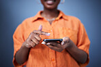 Typing hand, closeup and a phone on a dark background for communication, chat or connection. Contact, internet and a black woman with a mobile for social media or app isolated on a studio backdrop