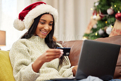 Buy stock photo Woman, laptop and credit card, e commerce and Christmas shopping, online payment for gift and bank app. Female person on sofa, internet banking on pc and finance, fintech and holiday donation at home