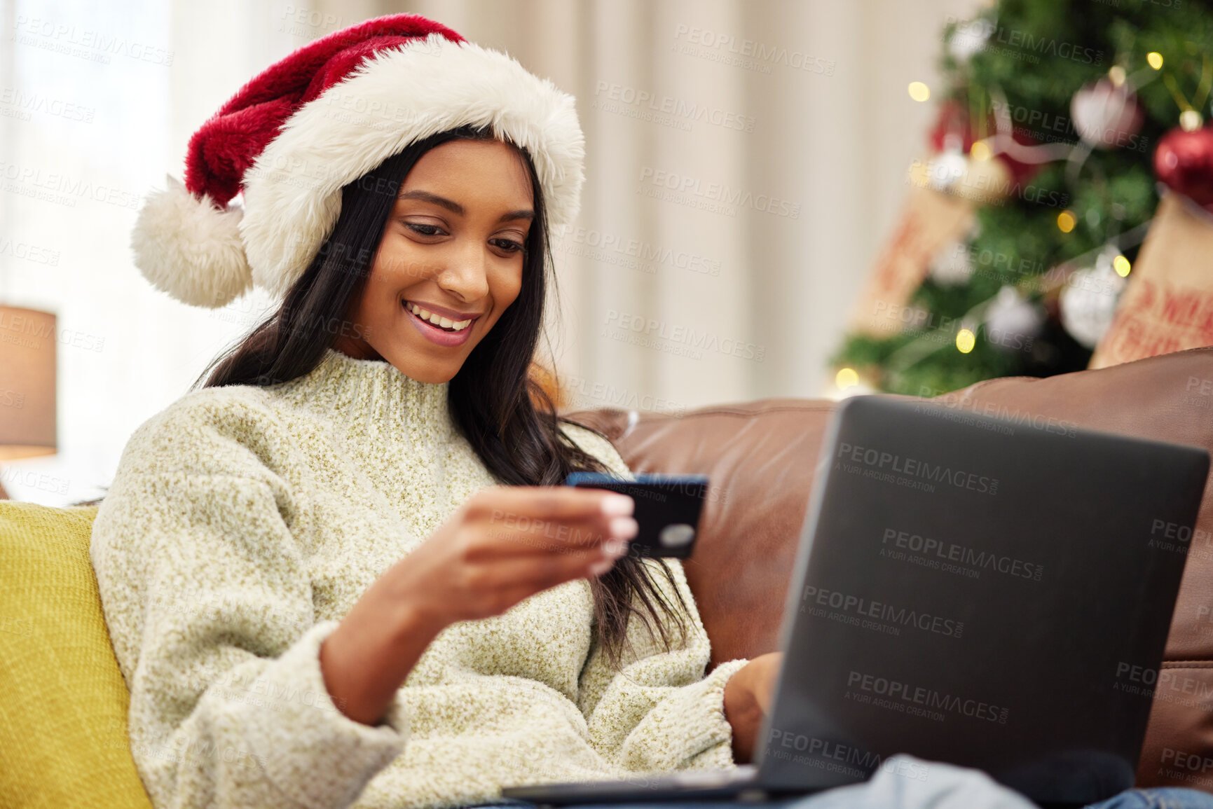 Buy stock photo Woman, laptop and credit card, e commerce and Christmas shopping, online payment for gift and bank app. Female person on sofa, internet banking on pc and finance, fintech and holiday donation at home