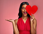 Woman, happy surprise and heart, marketing mockup in red dress and promotion of love on pink background. Valentines Day advertising, female model in portrait and wow expression for branding in studio