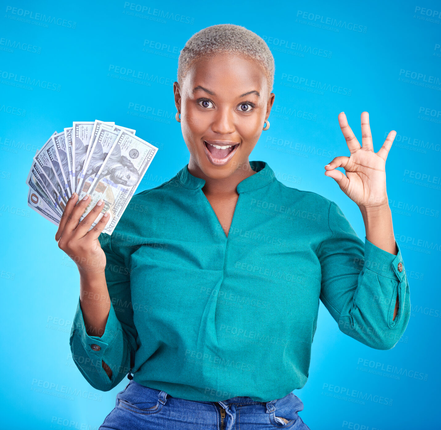 Buy stock photo Woman portrait, okay sign and money fan for bonus, financial success and winning, finance loan with wow. African person or winner surprise, yes and notes or cash profit on a studio, blue background