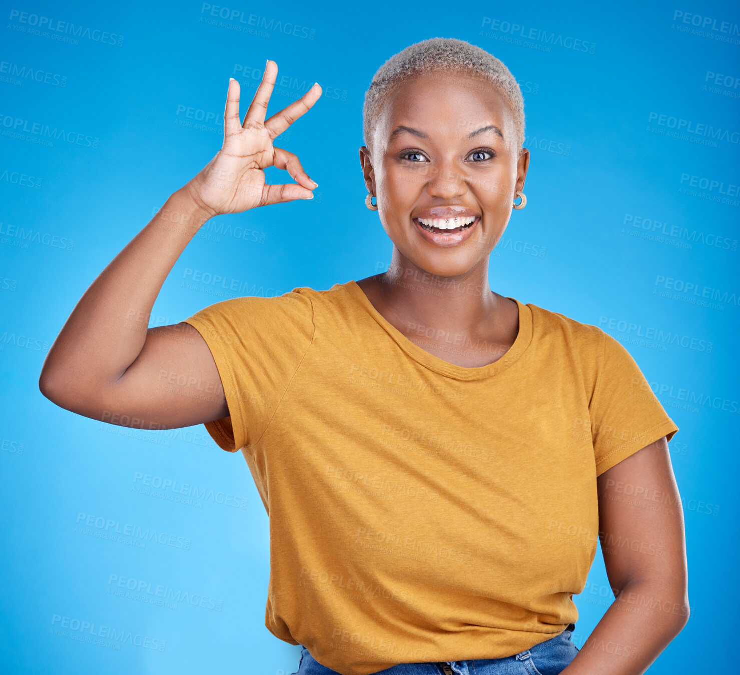 Buy stock photo Black woman, ok sign and smile in studio portrait for good review, vote and icon by blue background. African gen z girl, young student and hand for emoji, symbol and happy for feedback, like and yes