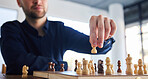 Chess, man moving a pawn and game of strategy, problem solving or person playing on chessboard in competition. Planning, choice and hand on knight or king, queen and player thinking of winning move