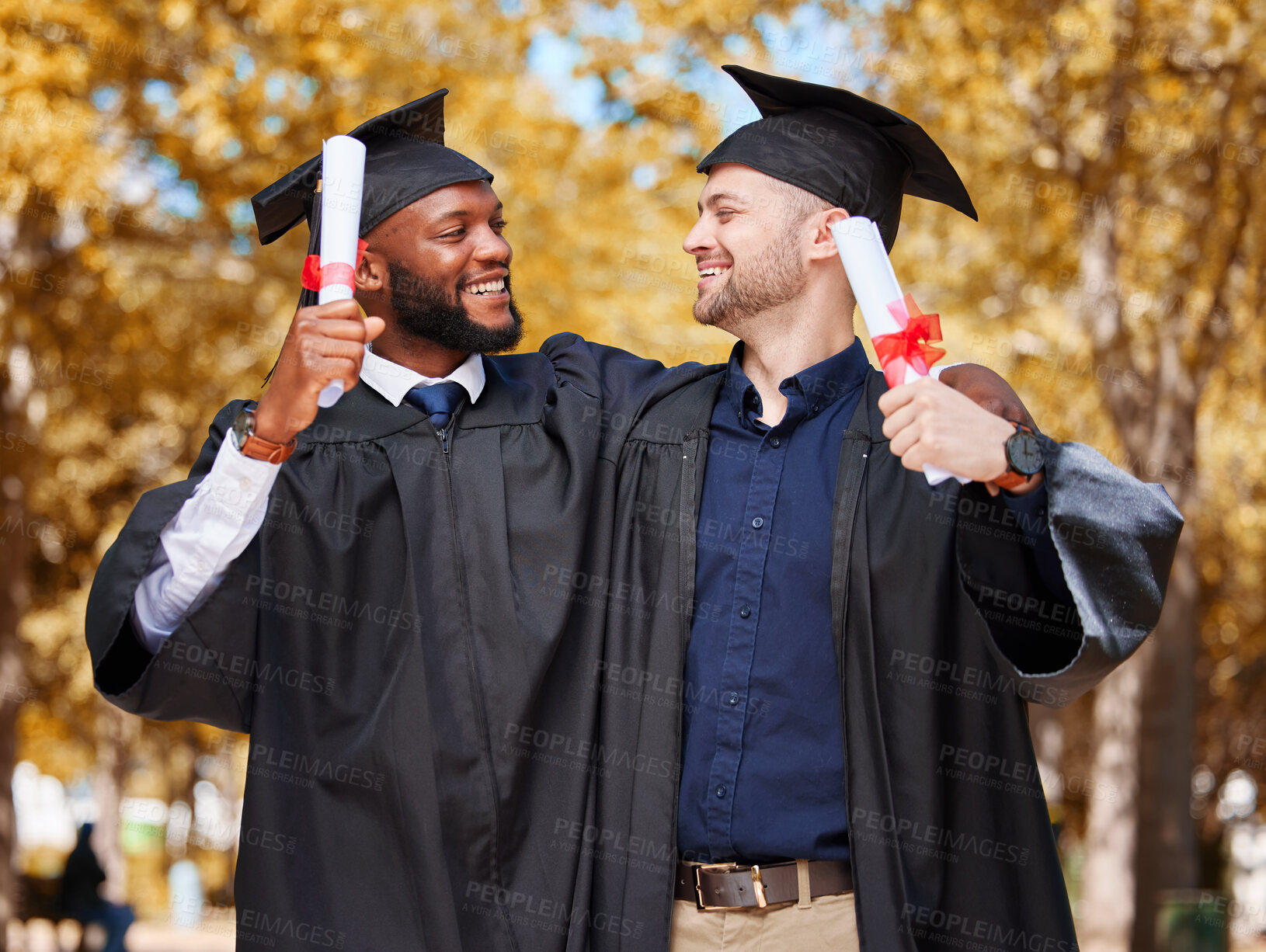 Buy stock photo Graduation, students and couple of friends on university, or campus achievement, success and celebration of diploma. Men, graduate or diversity people hug for education, certificate and award at park