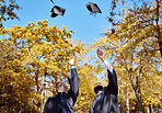 Graduation cap, students or friends and throw in air or sky for celebration, study success and achievement on campus. University people or graduate with college, school and education or scholarship