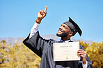 Certificate, graduation and success with black man pointing for award, winner and education. Scholarship, future and learning with university student on campus for achievement, study and diploma