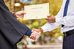 Hand shake, graduation and certificate for college student with professor, congratulations and event for learning. Education, celebration and party with diploma, paperwork and people with success