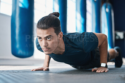 Buy stock photo Fitness, push up or man in gym training or exercising in a workout for endurance or strong arms. Healthy person, focus or powerful sports athlete in exercise challenge for wellness or development