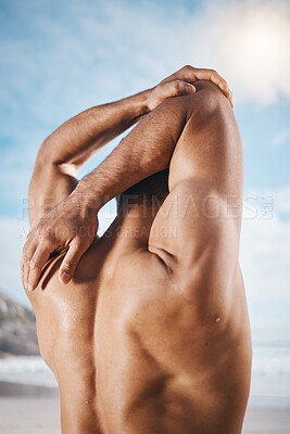 Buy stock photo Arm, stretching and back on man outdoor for training, running or workout at the beach. Hands, stretch and behind guy runner with body warm up in nature before exercise, run or cardio sport routine
