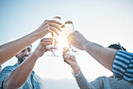 Happy, friends and hands toast with champagne, having fun and bonding at sunset. Smile, group and people cheers with wine glass, alcohol and drink for celebration on holiday, summer party and mockup.