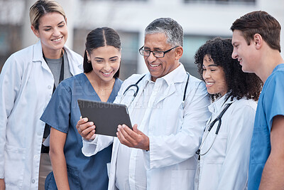 Buy stock photo Tablet, doctors and healthcare people at hospital outdoor with clinic management, research and online teamwork. Group, telehealth and medical staff, nurses and mentor with digital technology training