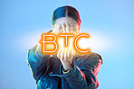Woman, hologram and btc with finance, business and promotion against a blue studio background. Female person, investment and model with a sign, financial and symbol for trading with profit growth