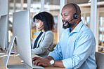 Call center, black man and consultant at computer for customer service, business support or help in CRM office. Happy telemarketing agent typing at desktop for telecom consulting in coworking agency