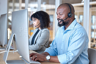 Buy stock photo Call center, black man and consultant at computer for customer service, business support or help in CRM office. Happy telemarketing agent typing at desktop for telecom consulting in coworking agency